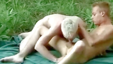 Sexy blonde with a big cock plays with her mouth and pussy